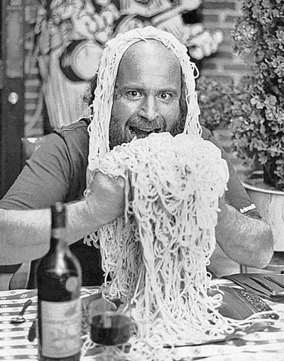 Picture of Ron Jacobs with pasta on his head, eating pasta